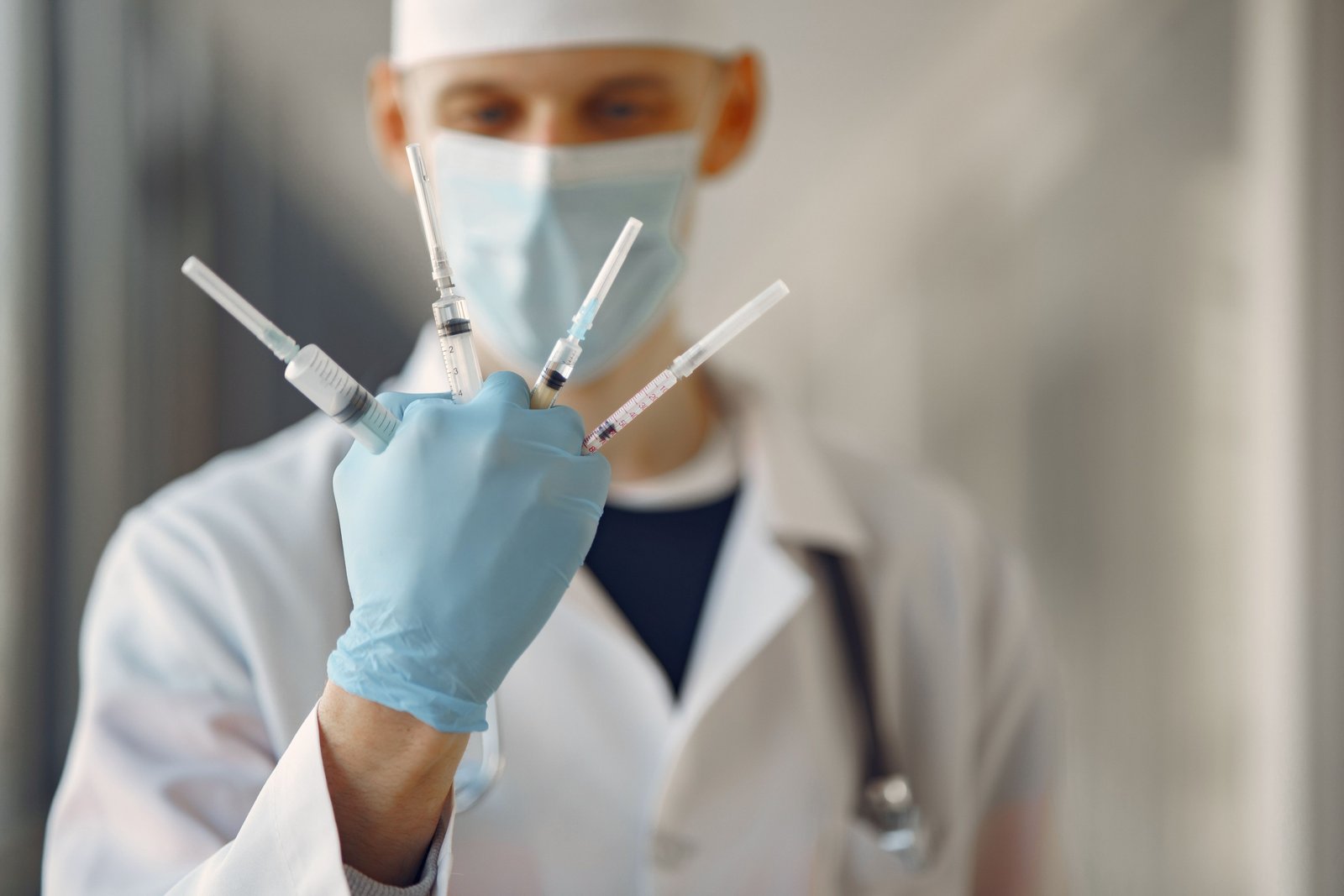 Travel nurse anesthetist preparing anesthesia in a hospital setting showcasing flexibility and diverse medical environments