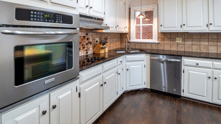 High-quality wooden travel trailer cabinet doors inside a cozy RV interior