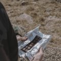 Portable travel snack bars in hiking backpack ready for outdoor adventure and sustained energy