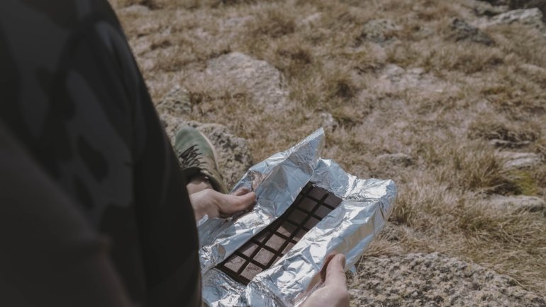 Portable travel snack bars in hiking backpack ready for outdoor adventure and sustained energy