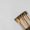 Eco-friendly travel cutlery set made of bamboo and stainless steel with carrying pouch outdoors