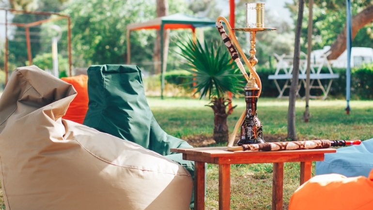 Compact and portable travel hookah set up outdoors for easy social smoking during travel and camping