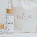 Travel size self tanner in a compact beauty bag for easy application and natural glowing skin while traveling