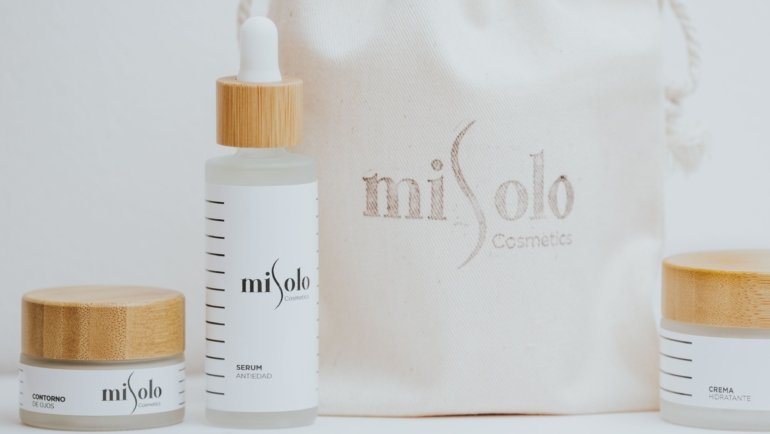 Travel size self tanner in a compact beauty bag for easy application and natural glowing skin while traveling