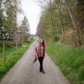 Traveler wearing a soft oversized travel shawl outdoors for warmth and style