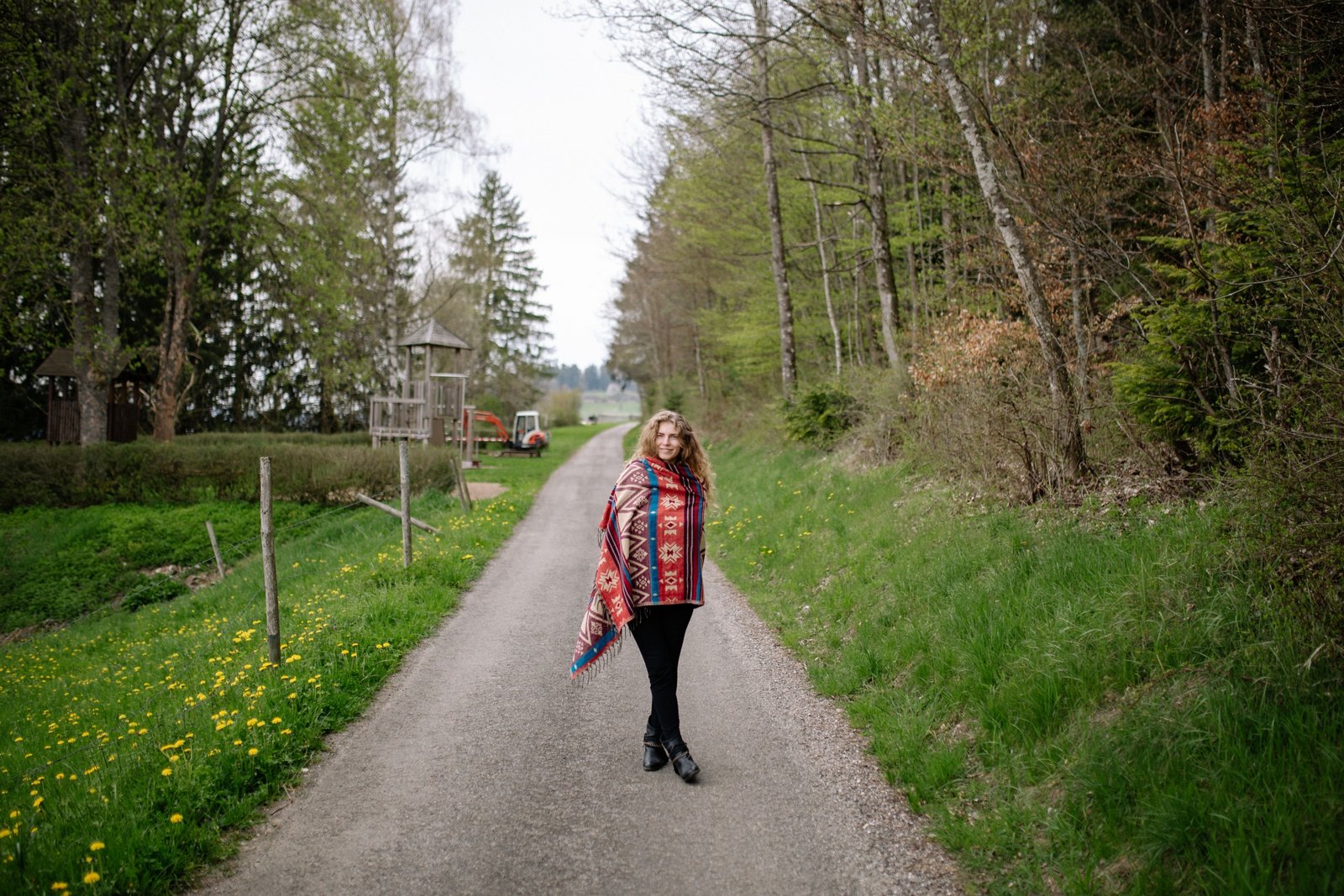 Traveler wearing a soft oversized travel shawl outdoors for warmth and style