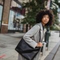 Stylish woman carrying a secure and comfortable shoulder bag for travel in the city