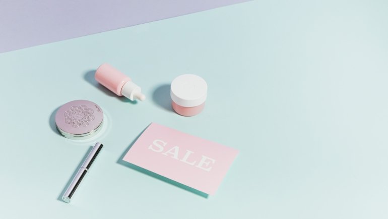 Travel-sized moisturizer with travel essentials showcasing skincare routine on the go