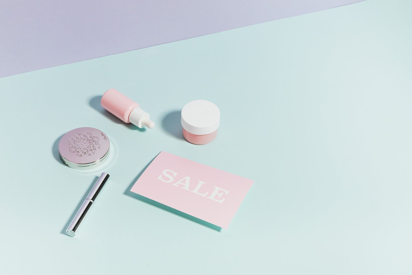 Travel-sized moisturizer with travel essentials showcasing skincare routine on the go