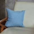 Traveler using an ergonomic travel lumbar pillow for back support and comfort during long trips