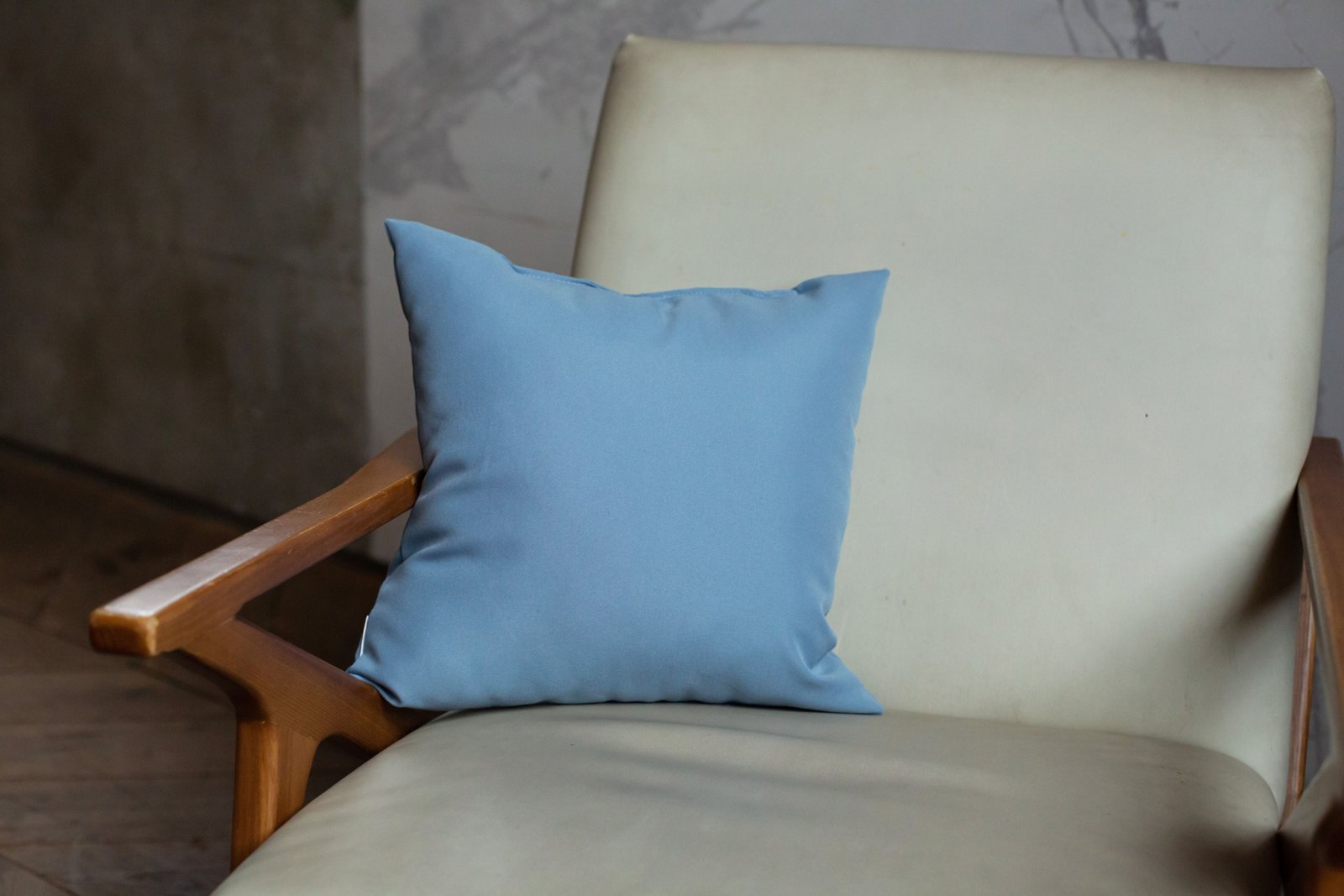 Traveler using an ergonomic travel lumbar pillow for back support and comfort during long trips