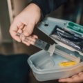 Portable travel sharps container for safe disposal of needles and medical waste during trips