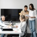 Independent travel agents collaborating and networking in a multi-level marketing travel agency environment