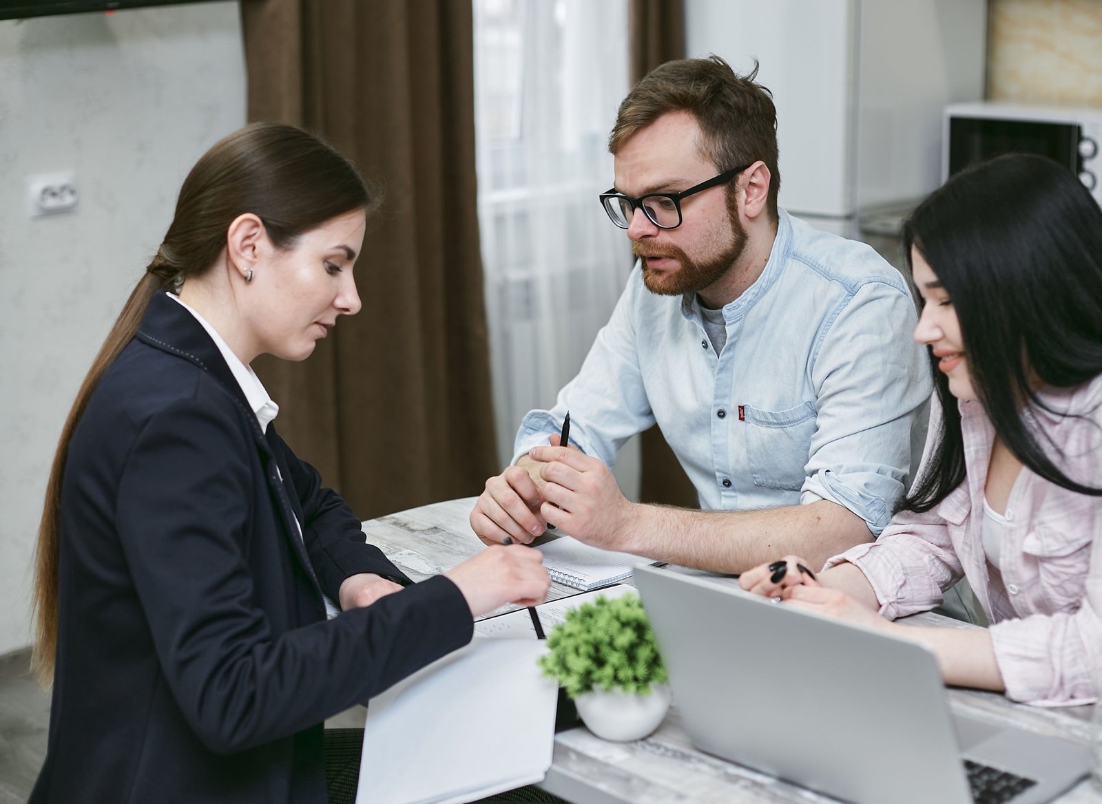 Travel agent helping client plan a vacation in Pittsburgh travel agency office