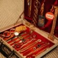 Large jewelry travel case open with organized compartments containing necklaces, rings, and bracelets for secure and convenient travel