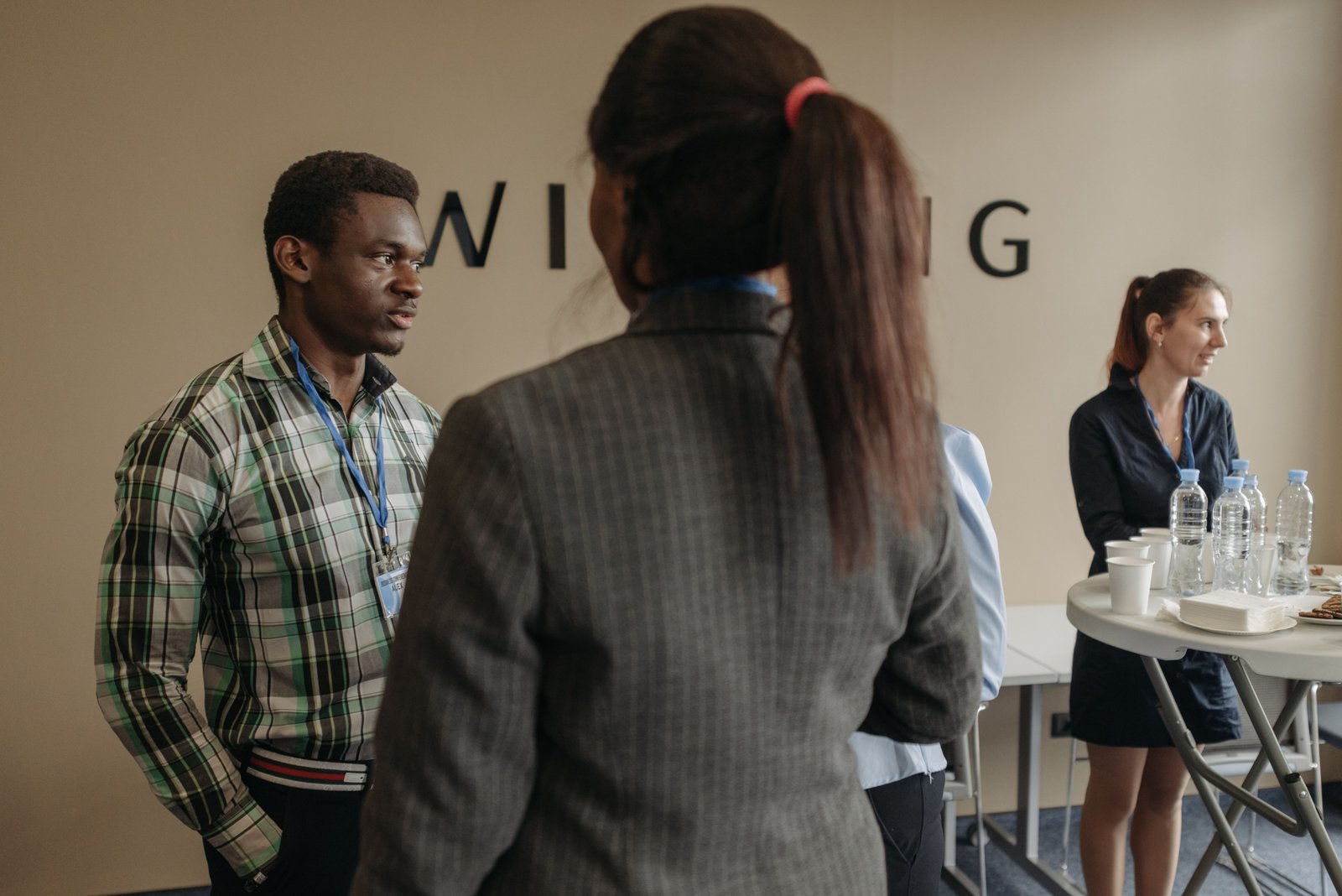 Group of diverse people networking and discussing travel business opportunities in a friendly meeting setting