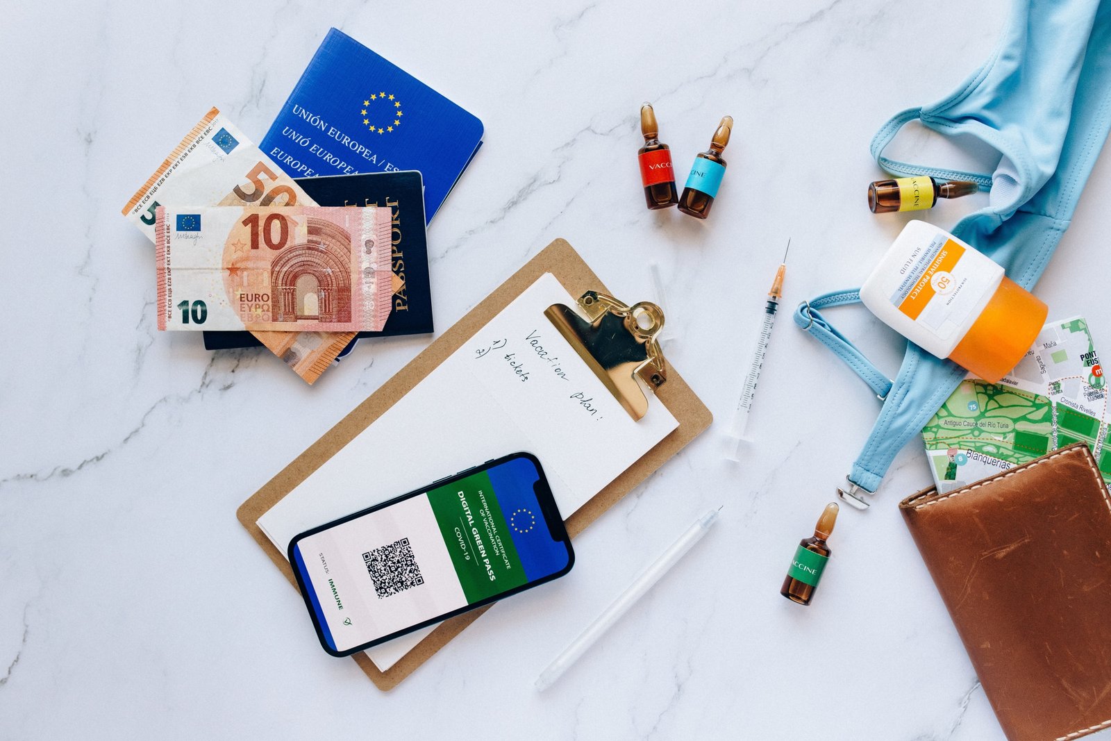 Traveler preparing important documents, health kit, and essentials for safe and well-organized international travel