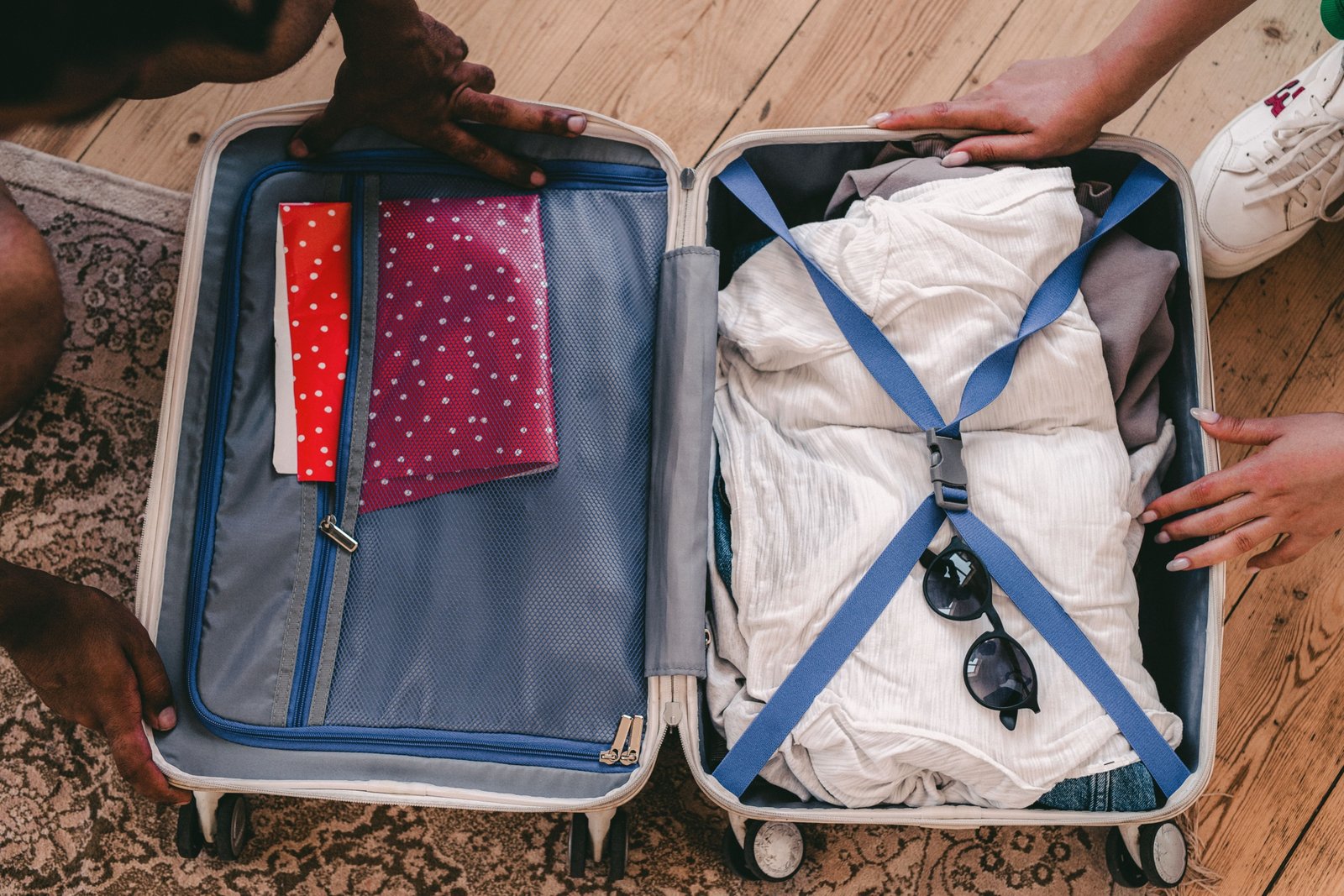 Travel laundry bag inside an organized suitcase for clean and dirty clothes separation during travel