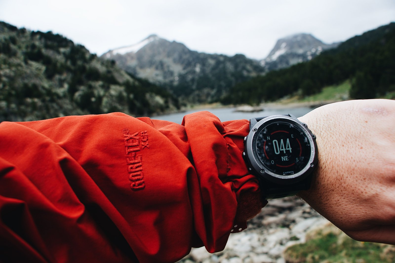 Close-up of a durable travel watch on a traveler's wrist in an outdoor setting showcasing style and functionality