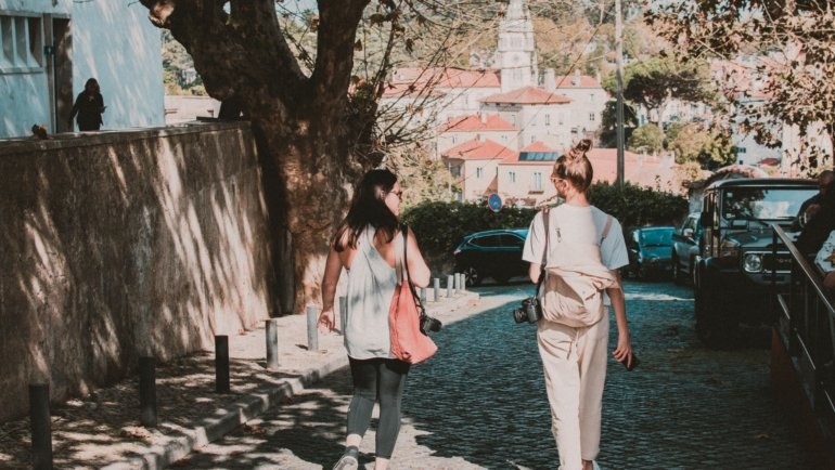 Woman wearing stylish and comfortable walking shoes exploring a European city street