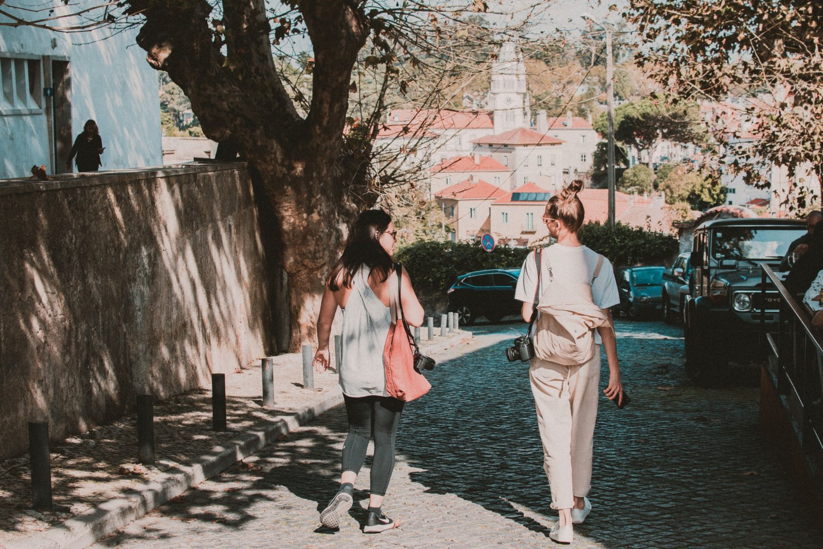 Woman wearing stylish and comfortable walking shoes exploring a European city street