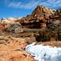 Scenic view of USA January travel destinations featuring warm sunny beach and snowy mountain with winter sports