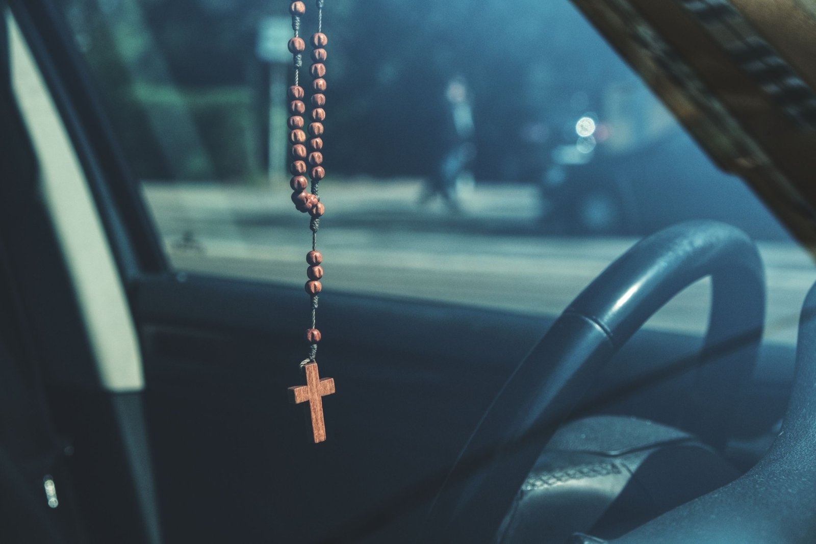 Catholic traveler praying for safety and protection before a journey