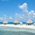 Sunny tropical beach with turquoise waters and clear skies in Belize during the dry season