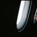 Child resting comfortably on airplane seat using a colorful children’s travel pillow for neck support
