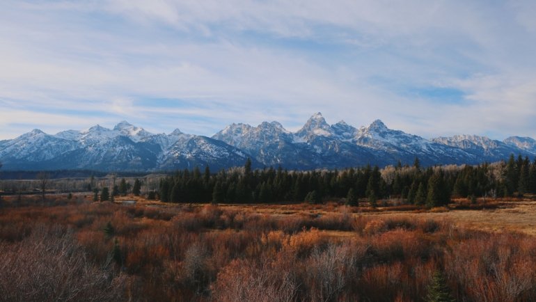 Scenic American West national park with red rock formations and expansive sky, perfect for outdoor travel and adventure in 2026