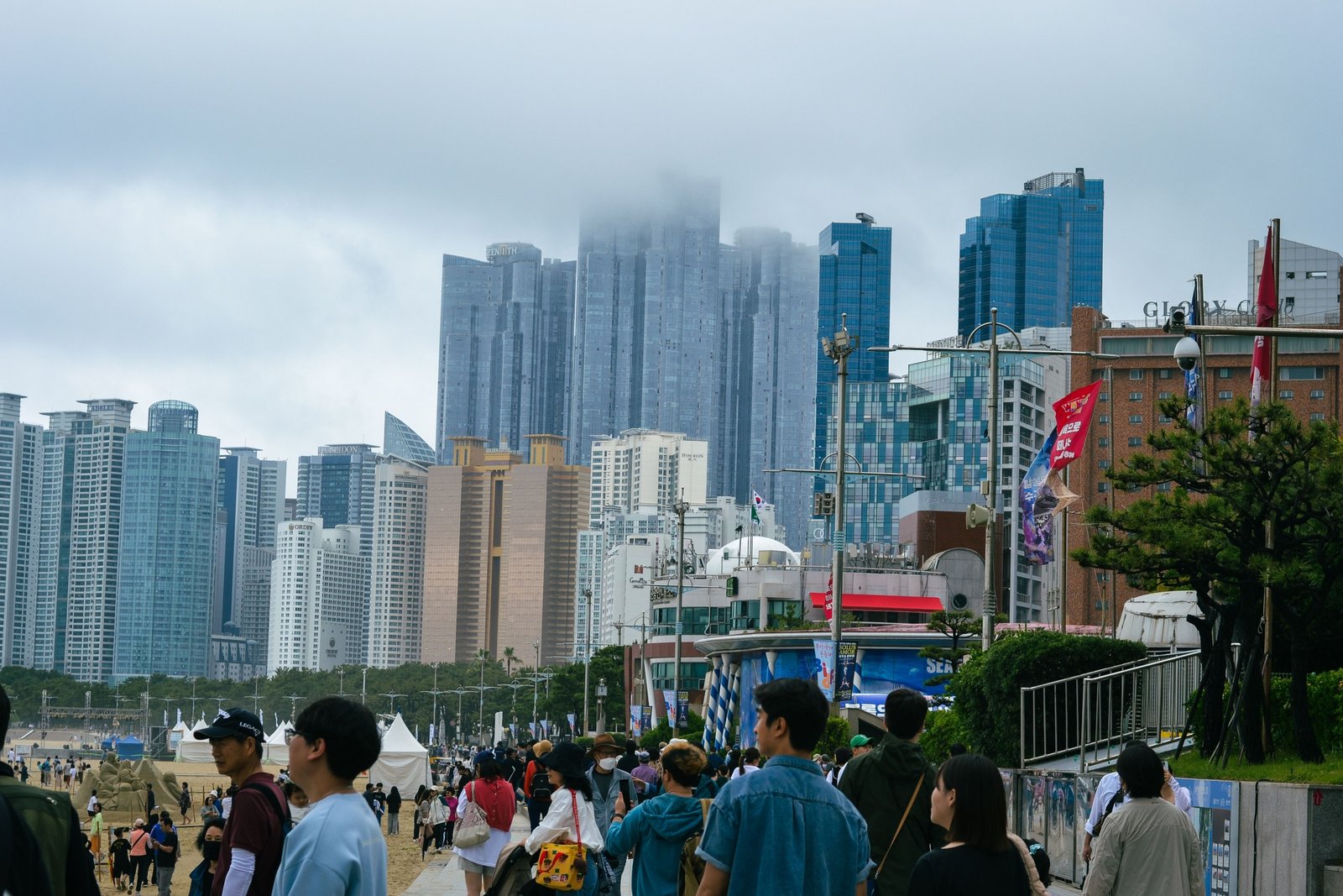 Scenic view of Busan coastline with Haeundae Beach and colorful city skyline, ideal travel destination in South Korea