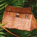 Leather travel watch pouch protecting luxury watches while packed in a travel bag