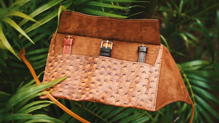 Leather travel watch pouch protecting luxury watches while packed in a travel bag