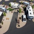 Scenic travel trailer park with parked trailers, natural surroundings, and camping amenities for a comfortable outdoor stay