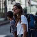 Traveler wearing a lightweight 25-liter backpack walking in city with organized gear for day travel