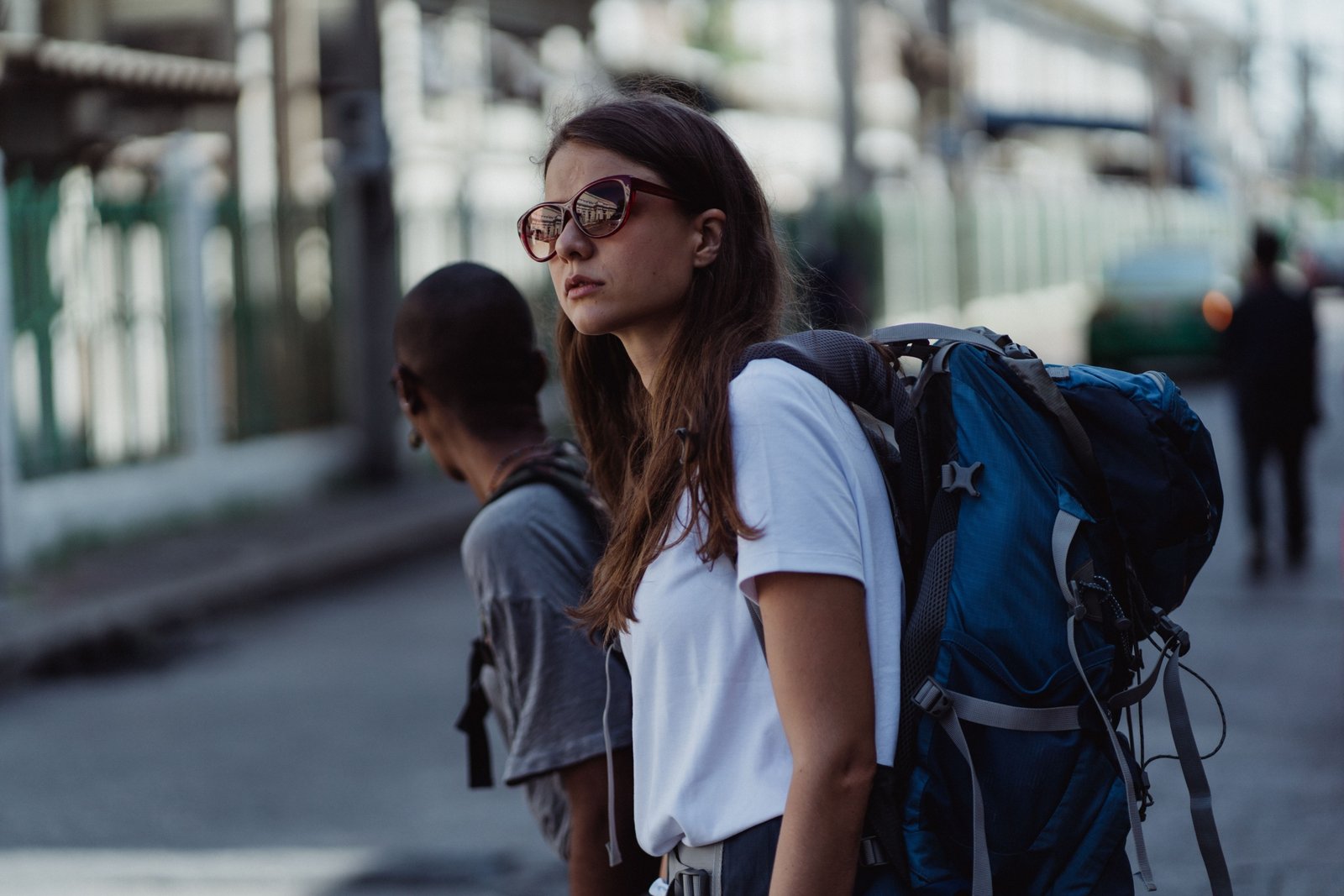 Traveler wearing a lightweight 25-liter backpack walking in city with organized gear for day travel