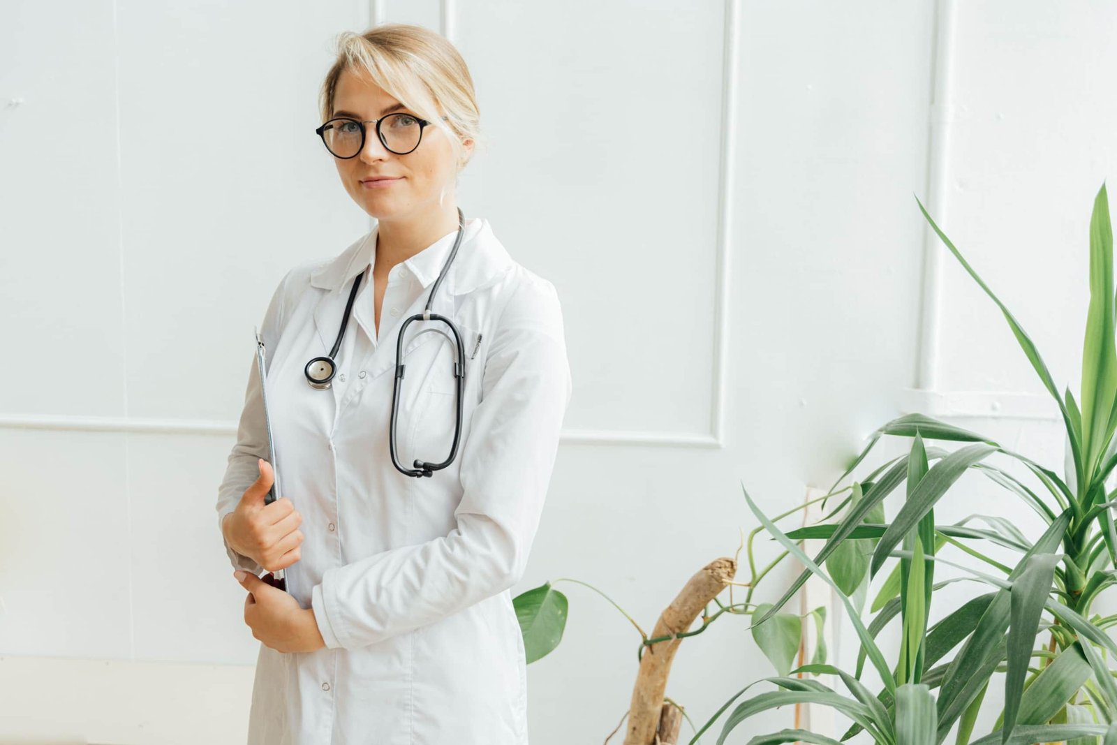 Allied health professional working in a clinical setting with travel gear, representing travel allied health jobs and career flexibility