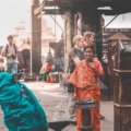 Respectful traveler interacting with locals while exploring cultural traditions responsibly