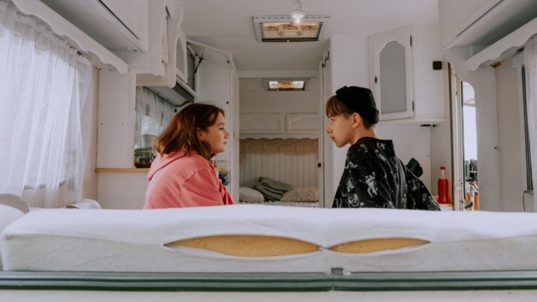 Cozy heated travel trailer interior showcasing warmth and comfort with built-in propane furnace during cold weather