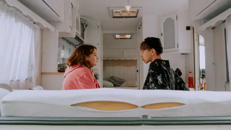 Cozy heated travel trailer interior showcasing warmth and comfort with built-in propane furnace during cold weather