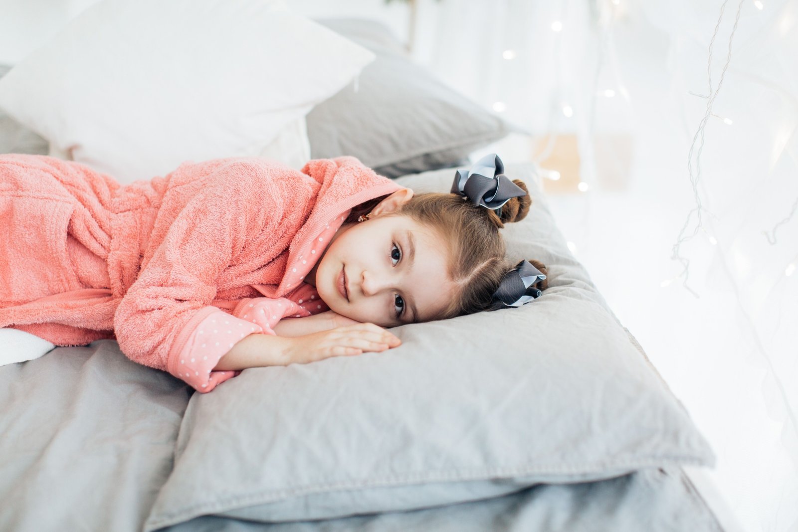 Toddler peacefully sleeping in a portable travel bed showing comfort, safety, and convenience for travel