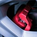 Close-up of electric drum brake system on a travel trailer showing brake components for safe towing