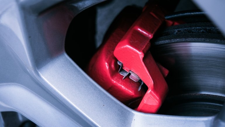 Close-up of electric drum brake system on a travel trailer showing brake components for safe towing