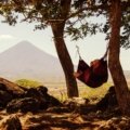 Sunny beach in Nicaragua with volcano in the background during dry season, perfect for travel and outdoor activities