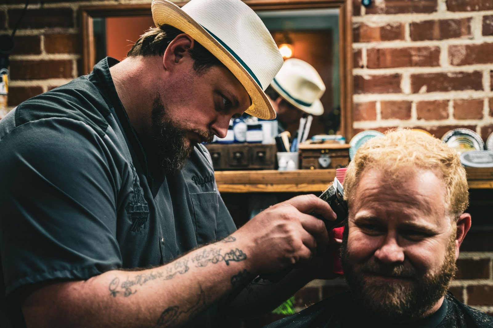Man getting a fresh haircut in a barbershop while traveling, combining grooming and adventure