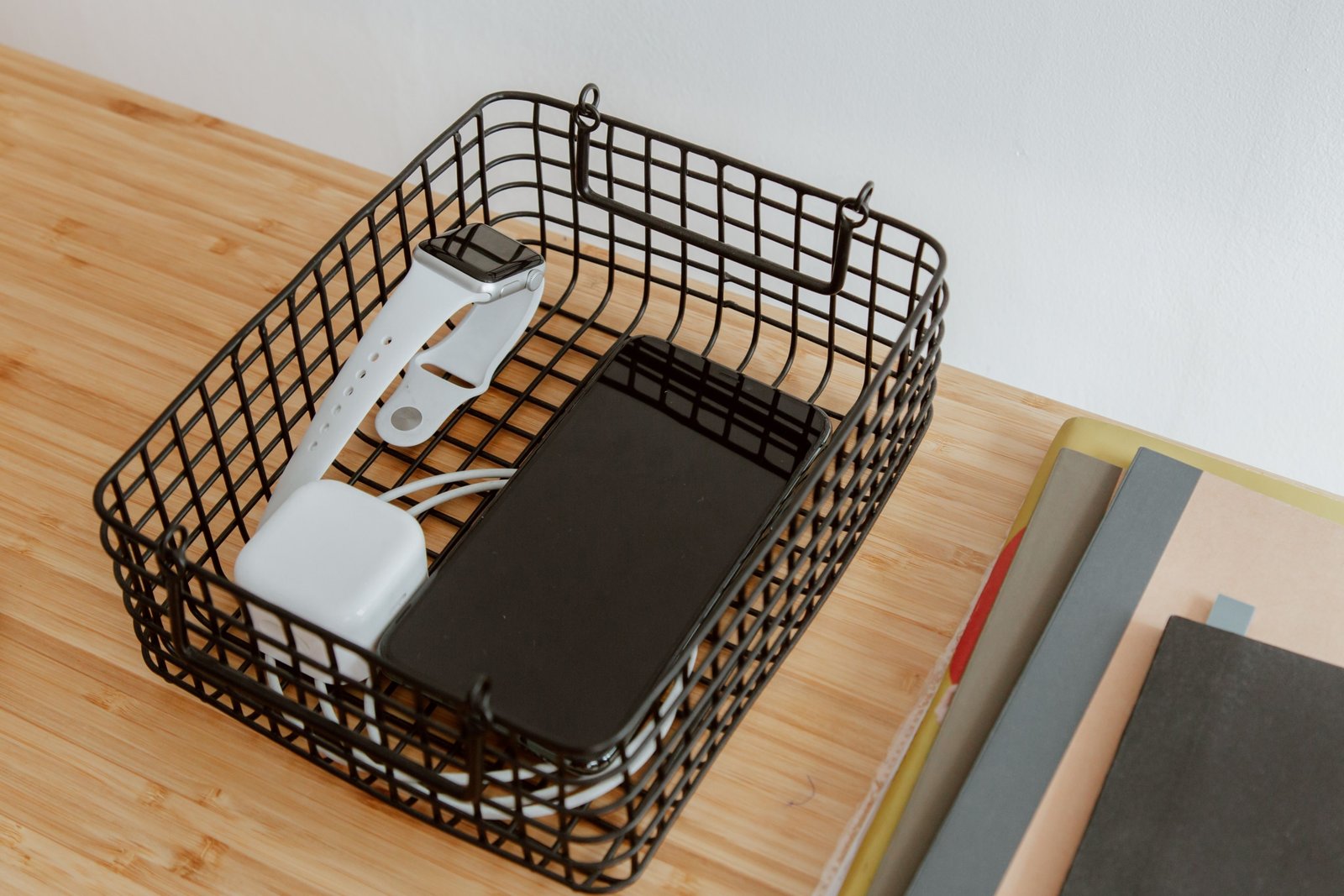 Organized travel tray with passport, phone, chargers, and snacks for easy access during airport security check