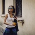 Durable stylish travel sunglasses with UV protection worn outdoors by traveler