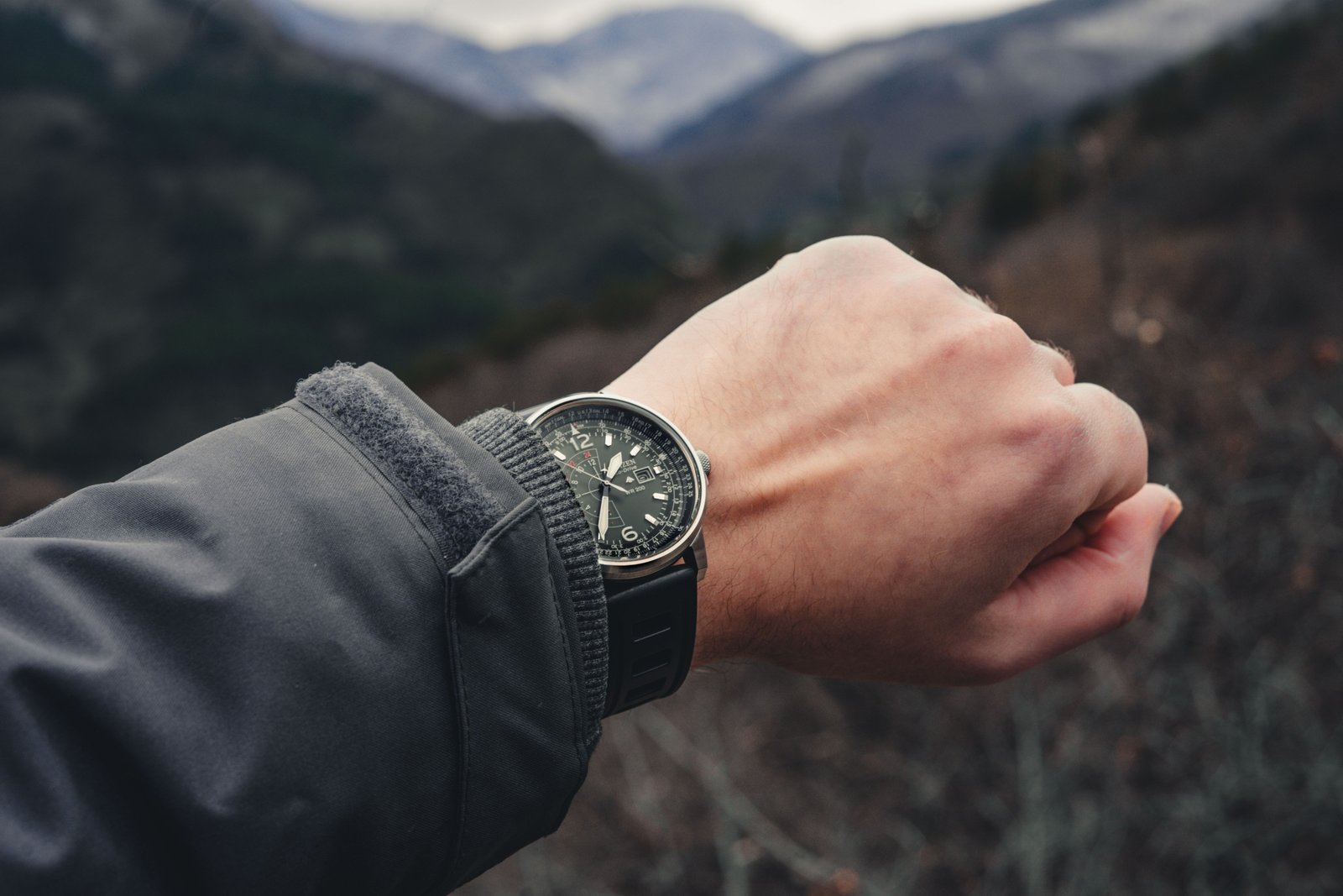 Traveler wearing a durable and stylish travel watch outdoors in nature