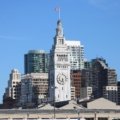 San Francisco tourism board meeting with city landmarks in the background, symbolizing leadership and strategic tourism planning in 2014