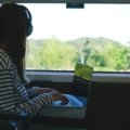 Remote work in travel technology with laptop and digital tools outdoors